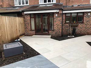 smooth stone patio and areas for planting