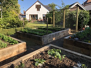 raised wooden beds made from railway sleepers